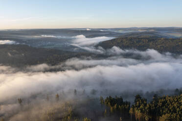Aerial view of Bleiloch Reservoir shrouded in thick morning fog - RUEF03554