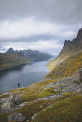 Young man hiking on mountain in Norway - TETF00077