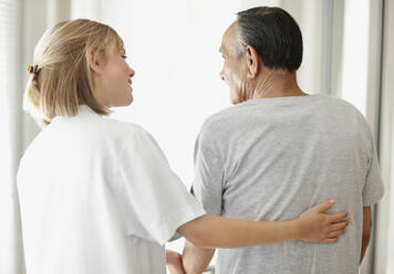 Nurse assisting patient with a walker - TETF00159