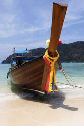 Traditional boat moored on beach - TETF00276