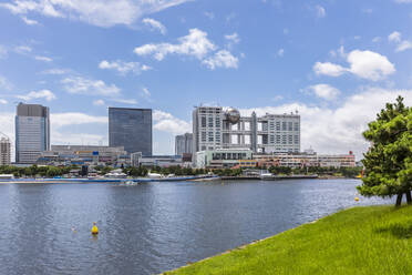 Japan, Kanto Region, Tokyo, Sumida River with Minato City skyline and Fuji Broadcasting Center in background - FOF12925