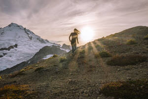 Silhouette of Female Hiking In Tights In Front Of Mount Baker - CAVF95630