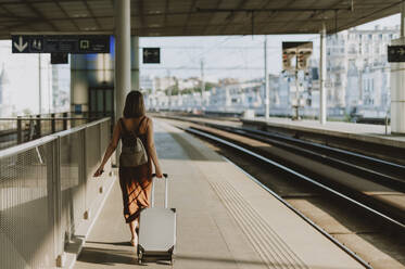 Tourist woman walking inside the train station in Antwerp - CAVF95771