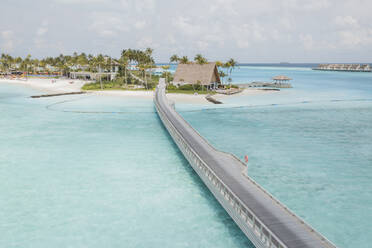 Aerial View Of Tropical Island Bridge Over Clear Blue Ocean And Luxury Resort, South Male Atoll Maldives. - AAEF14175