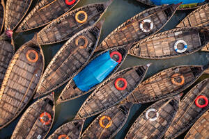 Aerial view of traditional fishing boats on Shitalakshya river in Bandar township, Dhaka state, Bangladesh. - AAEF14208