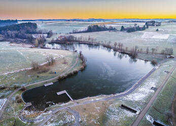 Aerial view of Aichstrut reservoir in winter at sunrise - STSF03138
