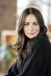 Beautiful woman with brown hair at home - DMOF00248