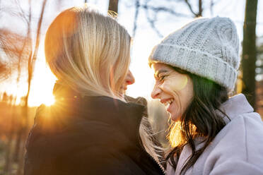 Happy girlfriends enjoying weekend on sunny day - DMOF00300