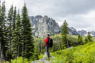 Senior man hiking by mountain in Stanley, Idaho, USA - TETF00570