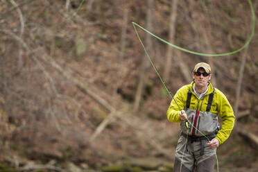 Young man fly-fishing - TETF00654