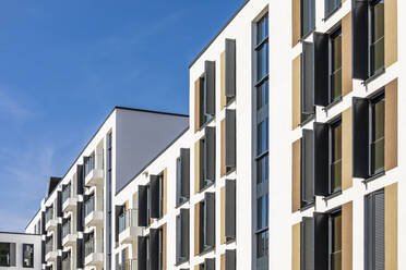 Germany, Baden-Wurttemberg, Esslingen am Neckar, Rows of shuttered apartment windows - WDF06856