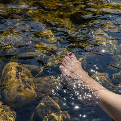 Woman's foot in river - TETF00826