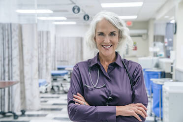 Portrait of smiling doctor with stethoscope - TETF00842