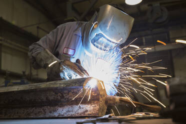 Man welding with sparks flying - TETF00895