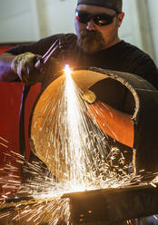 Welder working in metal workshop - TETF00940