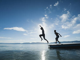 Boys (10-11,12-13) jumping from raft - TETF00990