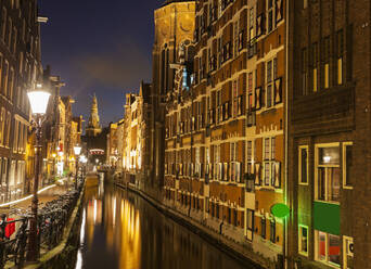 Illuminated buildings by canal at night - TETF01137