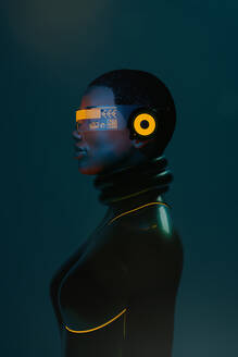 Side view portrait of black woman wearing augmented virtual reality goggles in metaverse - ADSF33935