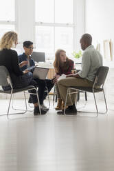 Friends having business meeting in office - TETF01287