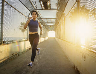 Woman jogging at sunset - TETF01300