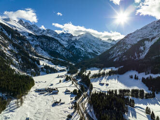 Germany, Bavaria, Oberstdorf, Helicopter view of sun shining over hamlet Birgsau in Allgau Alps - AMF09453