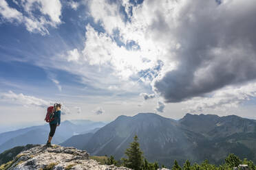 Female hiker admiring view from summit of Aiplspitz mountain - FOF12978