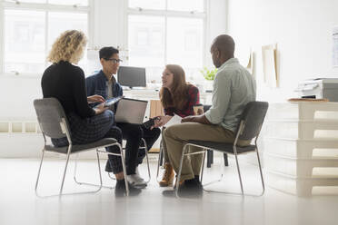 Friends having business meeting in office - TETF01426