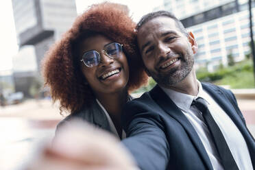 Two business colleagues taking selfie outdoors - JSRF01962