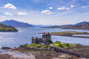 Eilean Donan castle seen from above on sunny day - SMAF02131