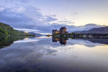 Reflection of Eilean Donan castle and Loch Duich on water - SMAF02145