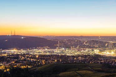 Germany, Baden-Wurttemberg, Stuttgart, Long exposure of illuminated Bad Cannstatt borough at dusk - WDF06867