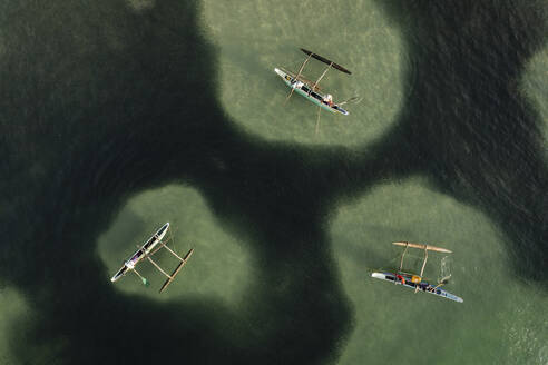 Aerial view of local fishermen in traditional wooden boats near Dickwella beach, Dikwella, Sri Lanka. - AAEF14267