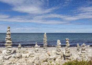 Stack of stones at beach on sunny day - OJF00506