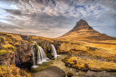 The Kirkjufell waterfall at sunrise, Snaefellsnes Peninsula, Western Iceland, Polar Regions - RHPLF21783