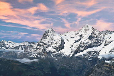 Majestic mountains Eiger and Monch under pink clouds at sunset, Murren Birg, Jungfrau Region, Bern Canton, Swiss Alps, Switzerland, Europe - RHPLF21820
