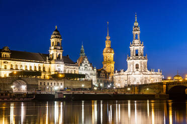 Germany, Saxony, Dresden, Elbe river at dusk with Dresden Castle and cathedral in background - EGBF00856