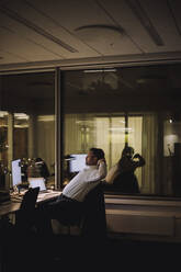 Tired businessman with computer and laptop on desk at work place - MASF29539