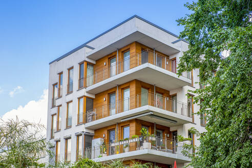 Germany, Berlin, Balconies of modern apartment building in new development area - MAMF02160