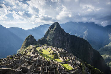 Machu Picchu, the Inca citadel high in the Andes, above the Sacred Valley, plateau with buildings and terraces. - MINF16506