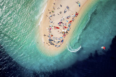 Split, Croatia - 07 July 2021: Aerial view of people doing windsurf along the coast near Split, Dalmatia, Croatia. - AAEF14445