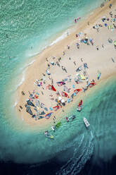 Split, Croatia - 07 July 2021: Aerial view of people doing windsurf along the coast near Split, Dalmatia, Croatia. - AAEF14446