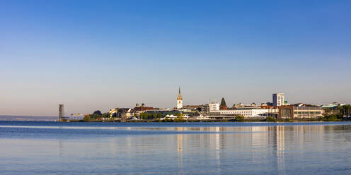Germany, Baden-Wurttemberg, Friedrichshafen, Panoramic view of town on shore of Lake Constance at dusk - WDF06925