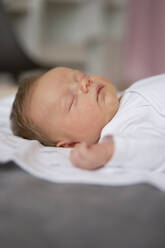 Cute baby boy sleeping on bed at home - SSGF00847