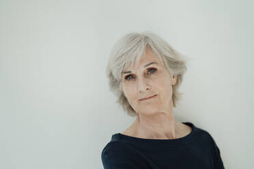 Senior senior woman with gray hair against white background - JOSEF09312