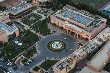 Egypt, Cairo, Elevated view of circular town square with fountain in center - TAMF03332