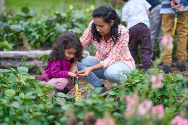 Mother and daughter gardening - CAIF32398