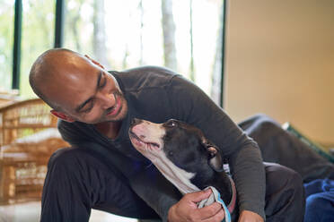 Happy man with dog - CAIF32417