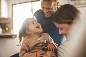 Playful parents with son and daughter at home - JOSEF09491