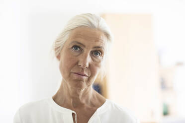 Contemplative mature woman with white hair at home - SGF02906