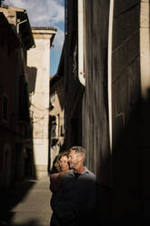 Mature couple enjoying sunlight on face at sunny day - JOSEF09670